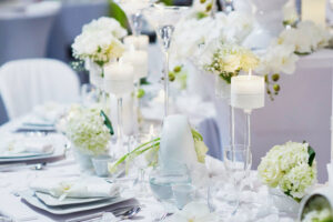 Beautiful table set with candles and flowers for a festive event