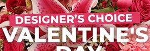 “Designer’s choice Valentine’s Day” written over a selection of pink Valentines Day flowers